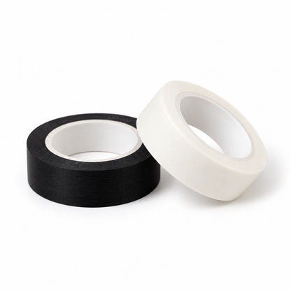 Black and white paper tape rolls on white