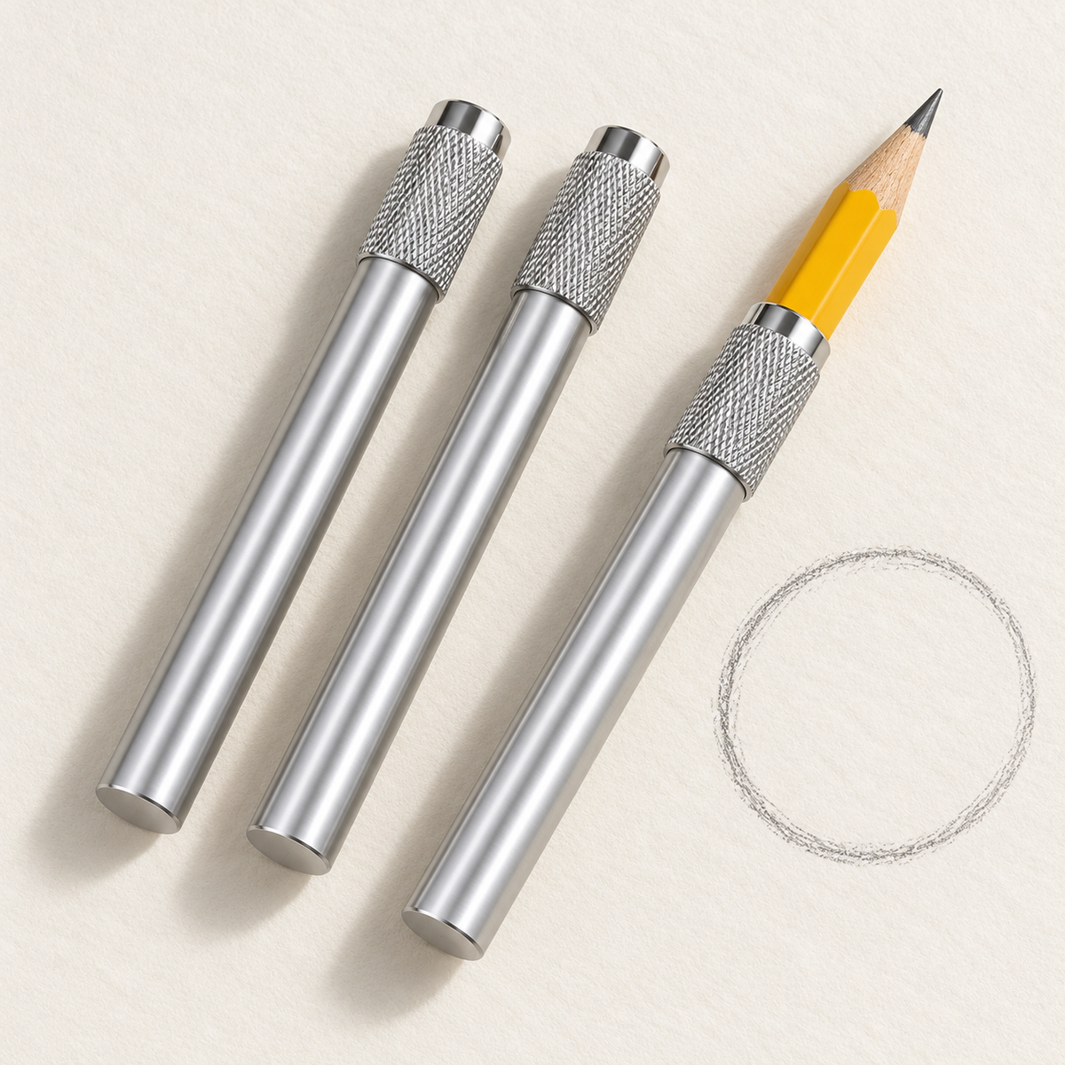 Three silver holders with one pencil inserted
