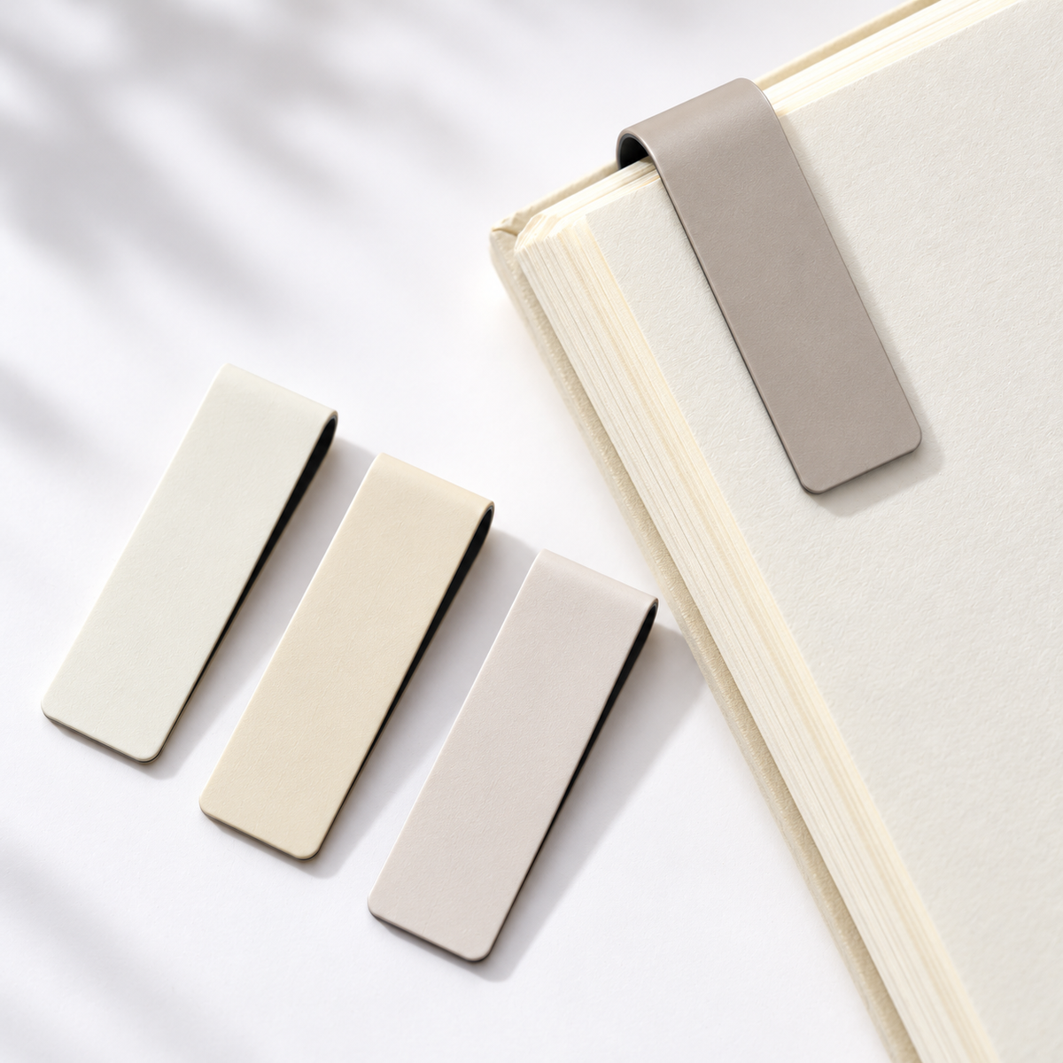 Magnetic bookmark folded over a book page